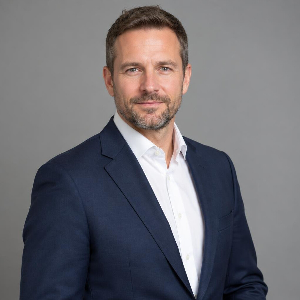 Portrait of a man in a suit with a short beard